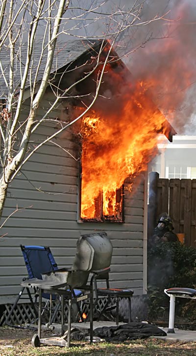 house on fire causing damage